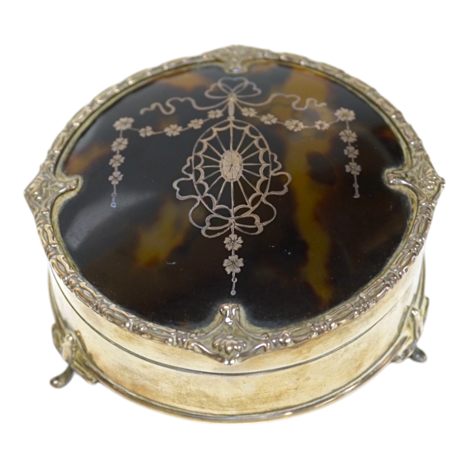 A George V silver and tortoiseshell pique mounted trinket box, by Mappin & Webb, Birmingham, 1918, circular diameter 94mm Condition - fair to good